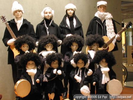 musical goth-folk caroling quartet with a chorus of eight afro-clad children