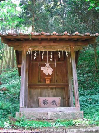 tall wooden altar on the hill, behind the shrine buildings