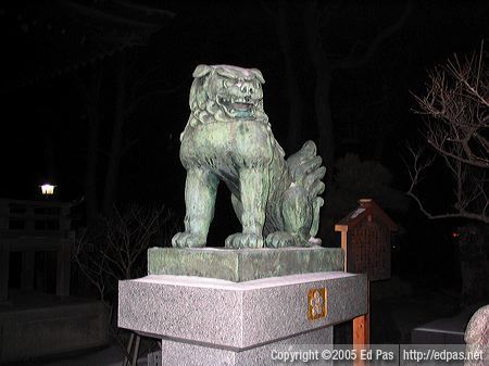 open-mouthed bronze lion dog at Sugawara Shrine in Tobata, Kitakyushu