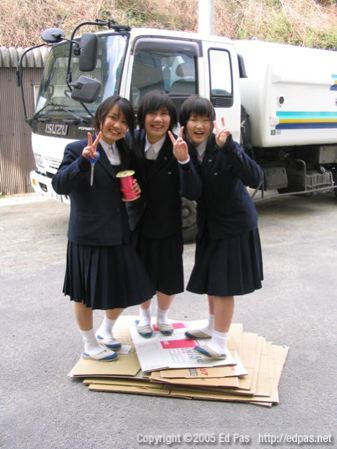 photo of girls standing on cardboard