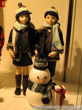 black-clad winter children, with matching snowman