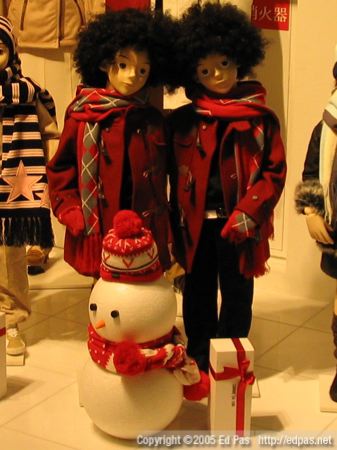 red-clad winter children, with matching snowman and afro wigs