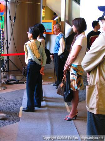 people of various ages, watching trapeze artists