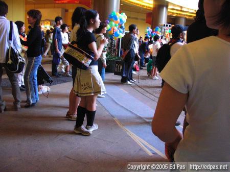 Daisygirl, with a woman in white racing-striped blue jeans in the background