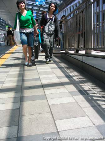 women on the elevated walkway to Laforet Harajuku, north of Kokura station