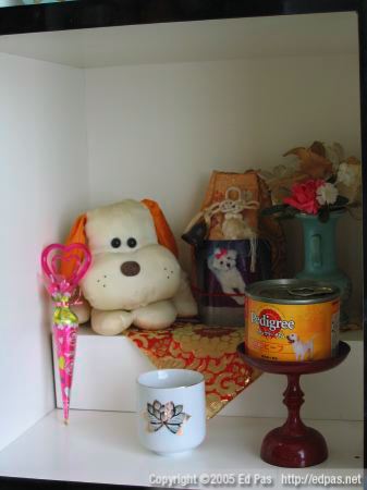 minimalist altar to a fluffy white dog