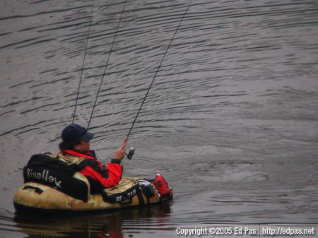 close-up image of a fisherman in his personal fishing vessel