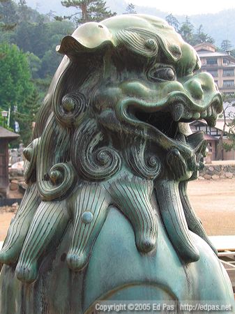 bronze lion dog at Itsukushima Shrine, looking out to sea