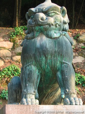bronze lion dog on the path to Itsukushima shrine