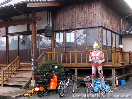 Ultraman makes a pit stop at a neighbourhood temple in Showa-machi